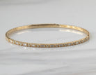 2/5ct. t.w. Round and Baguette Cut Diamond Bangle Bracelet in 14K Yellow Gold