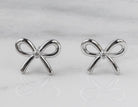 .02ct. t.w. Diamond Bow Earrings in Sterling Silver