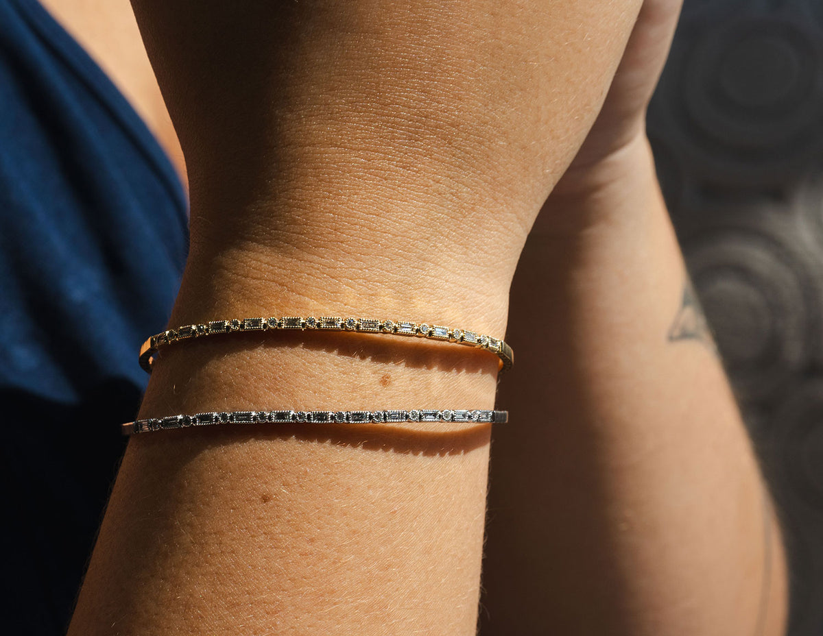 2/5ct. t.w. Round and Baguette Cut Diamond Bangle Bracelet in 14K Yellow Gold