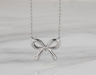 .02ct. Diamond Bow Pendant in Sterling Silver