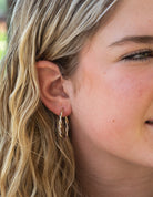 Twisted Oval Hoop Earrings in 10K Yellow and White Gold