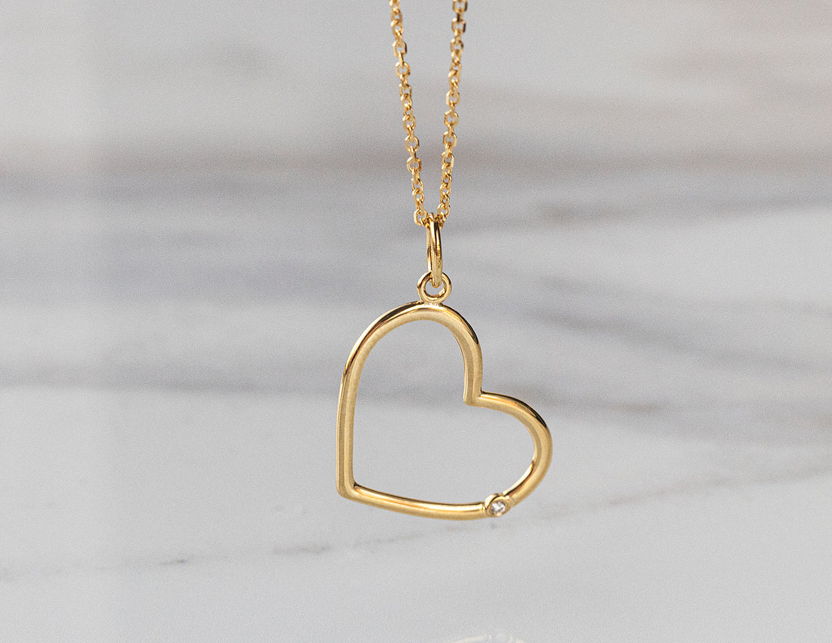 .01ct. Diamond Open Heart Pendant in 14K Yellow Gold