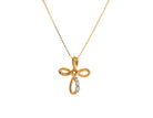 .05ct. t.w. Diamond Cross Pendant in 10K Yellow Gold