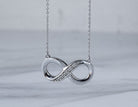 .03ct. t.w. Diamond Infinity Pendant in Sterling Silver