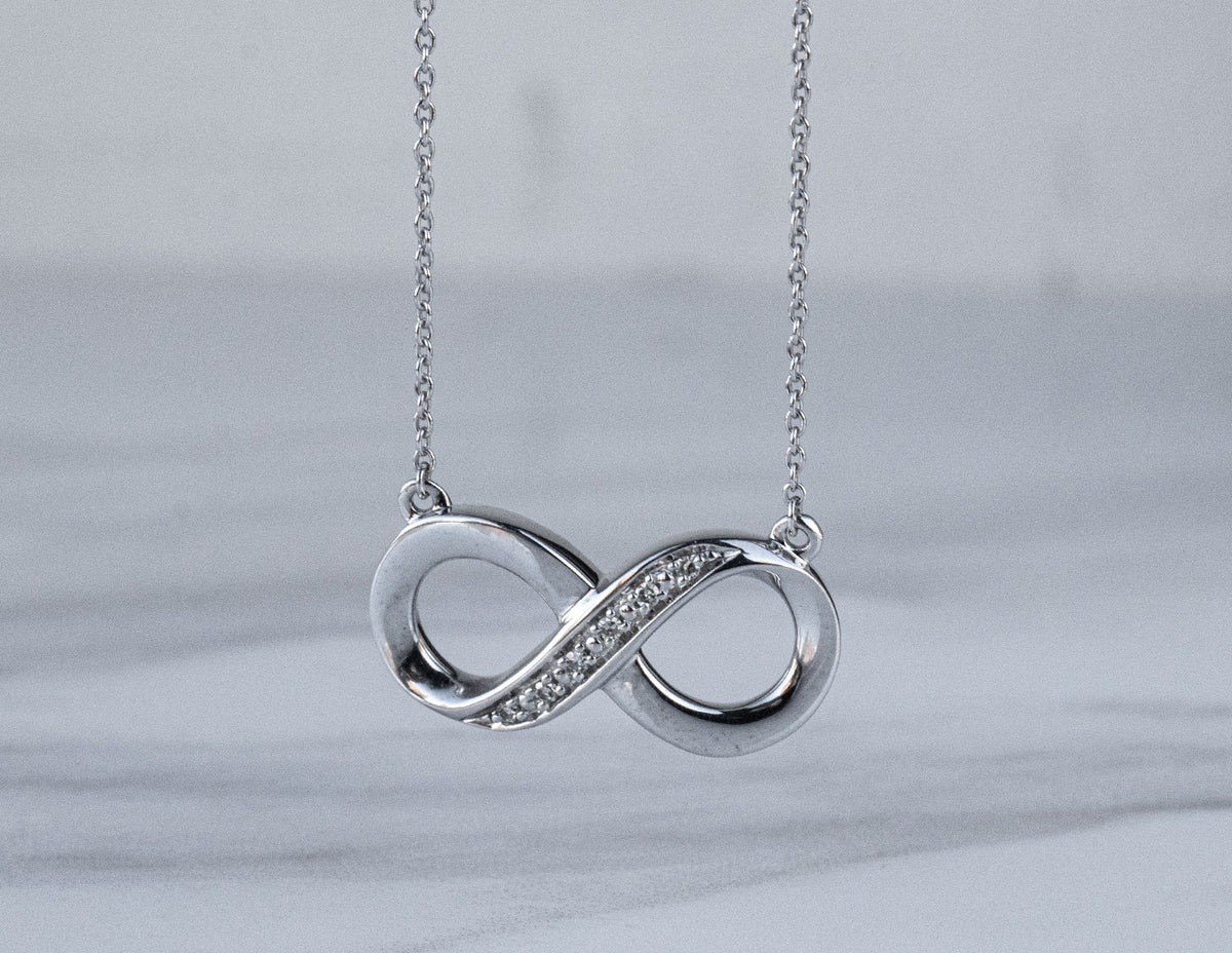 .03ct. t.w. Diamond Infinity Pendant in Sterling Silver