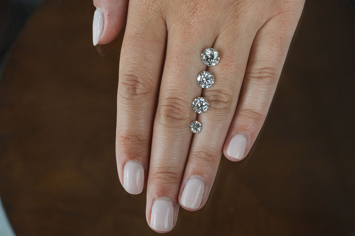 Diamond carat weight being measured on a scale