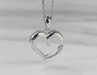 .03ct. t.w. Diamond Journey Heart Pendant in Sterling Silver