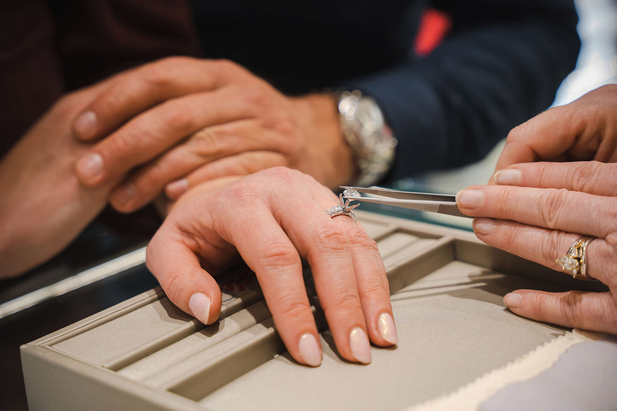 Jeweler inspecting diamond clarity with a loupe