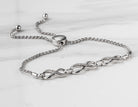 1/14ct. t.w. Diamond Infinity Bracelet in Sterling Silver
1/14ct. t.w. Infinity Bracelet in Sterling Silver
