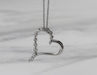 1/10ct. t.w. Diamond Journey Heart Pendant in Sterling Silver
