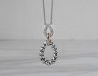 1/7ct. t.w. Diamond Drop Pendant in 14K Yellow Gold and Sterling Silver
