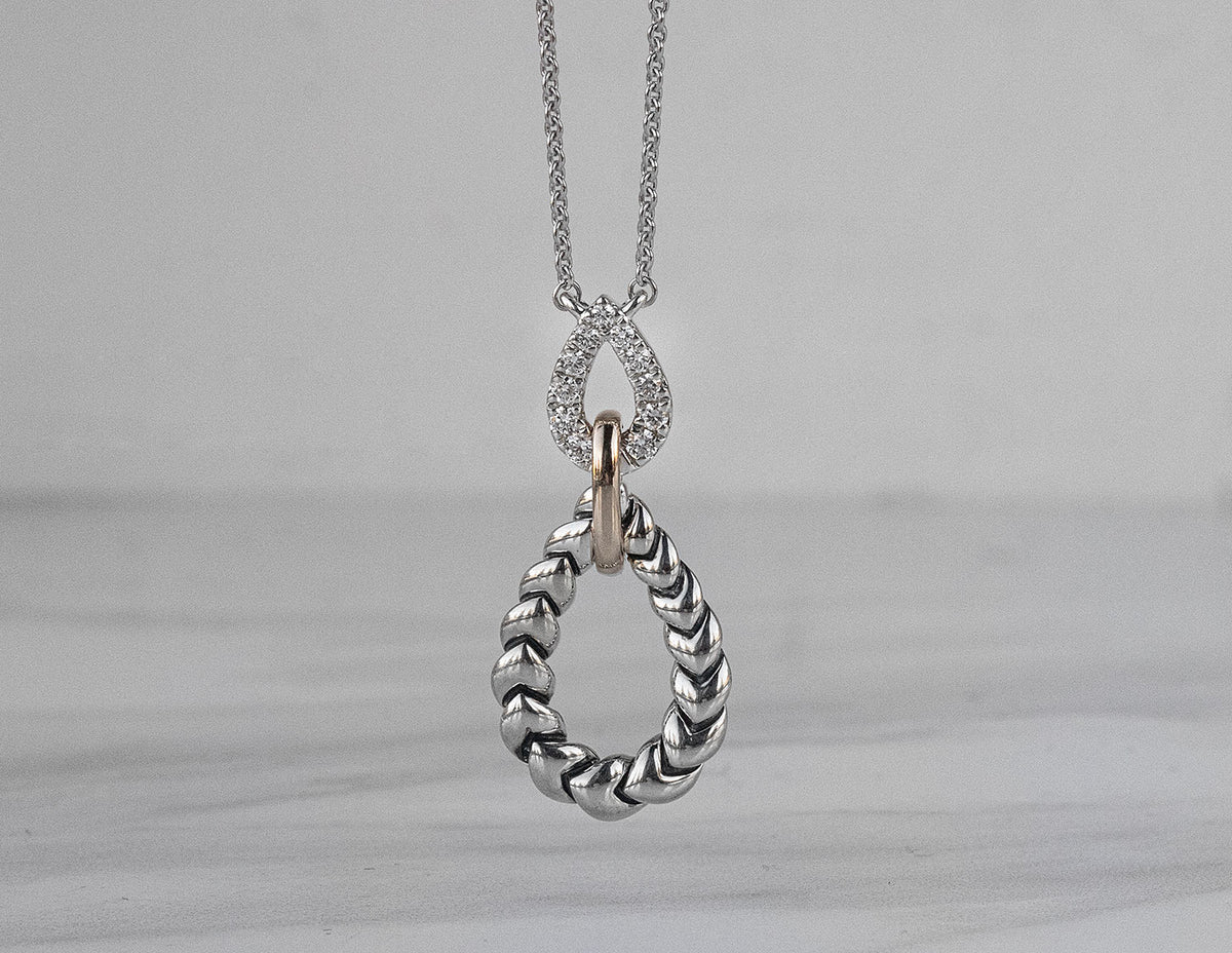 1/7ct. t.w. Diamond Drop Pendant in 14K Yellow Gold and Sterling Silver