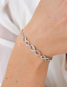 1/14ct. t.w. Diamond Infinity Bracelet in Sterling Silver
1/14ct. t.w. Infinity Bracelet in Sterling Silver