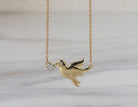 .02ct. t.w. Diamond Dove Pendant in 10K Yellow Gold