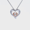 1/14ct. Diamond Dancing Hearts Pendant in Sterling Silver and 10K Rose Gold
