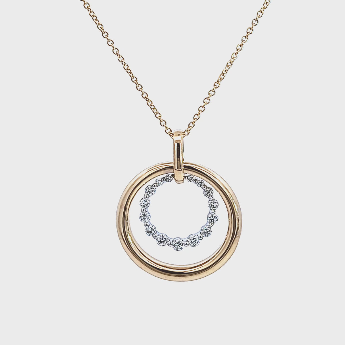 2/5ct. t.w. Diamond Double Circle Pendant in 14K Yellow and White Gold