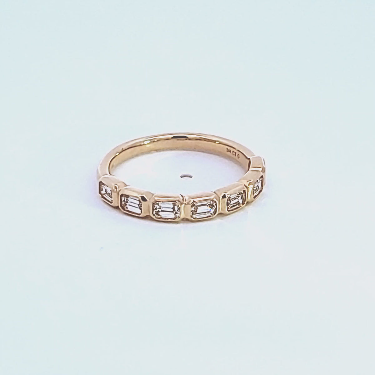 3/4ct. t.w. Emerald Cut Diamond Anniversary Bezel Ring in 14K Yellow Gold