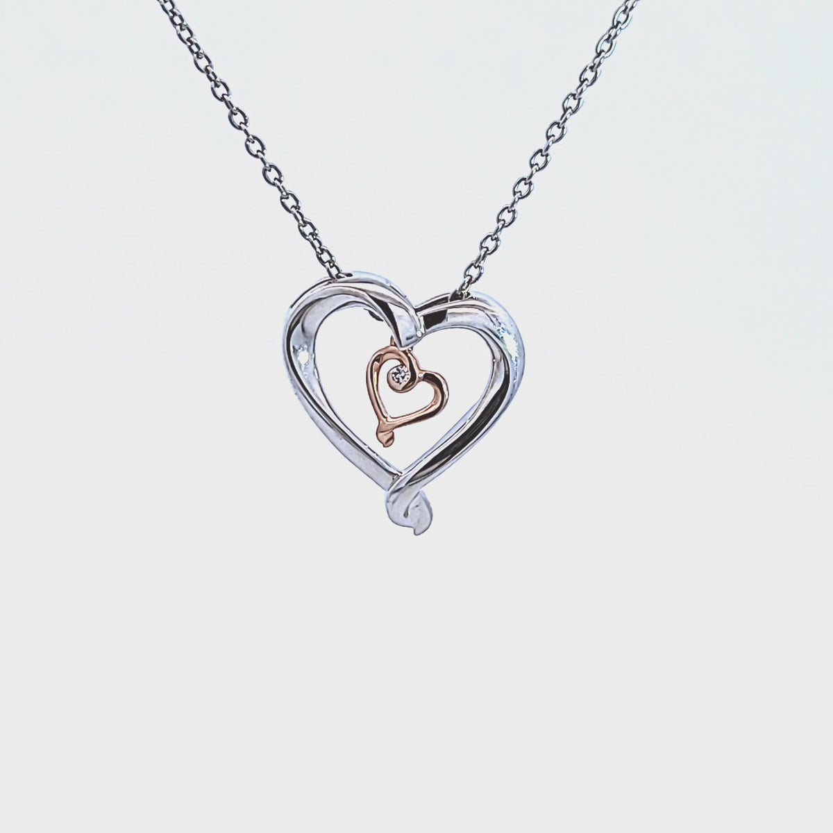 .01ct. Diamond Pendant in Sterling Silver and 10K Rose Gold