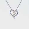 .01ct. Diamond Pendant in Sterling Silver and 10K Rose Gold