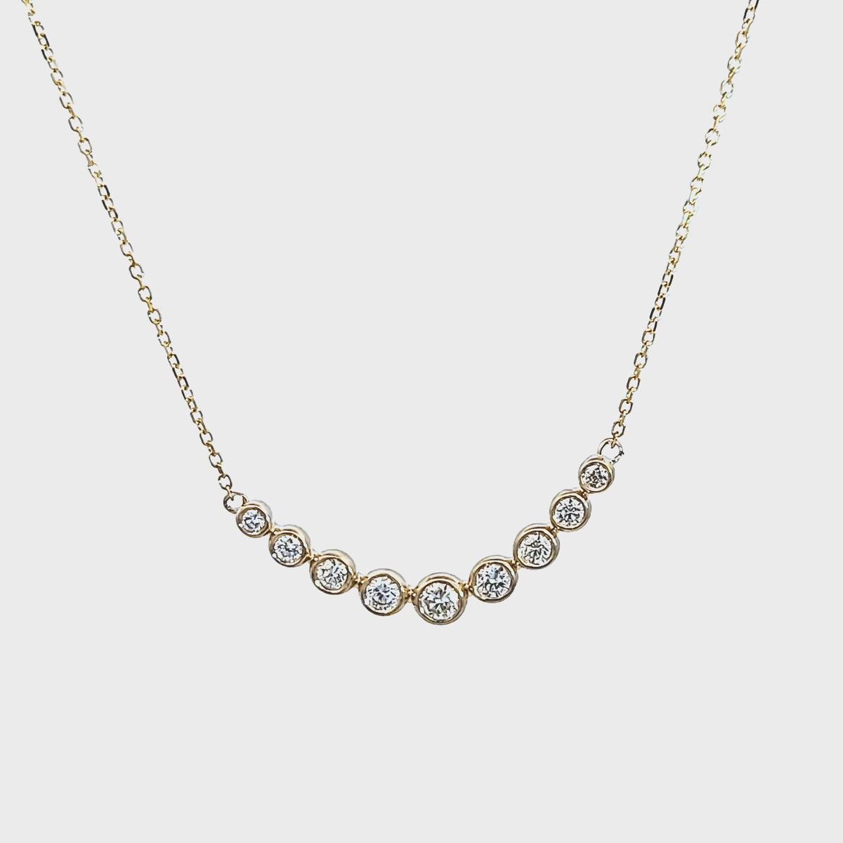 1/3ct. t.w. Diamond Graduated Curved Bar Pendant in 14K Yellow Gold