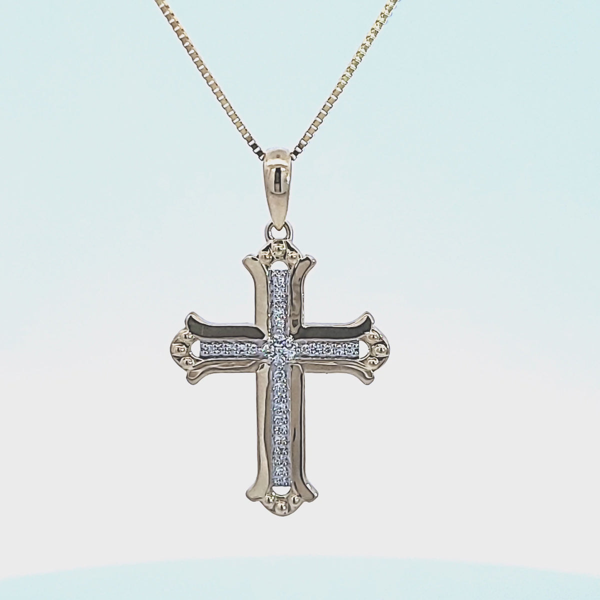 1/10ct. t.w. Diamond Cross Pendant in 10K Yellow Gold