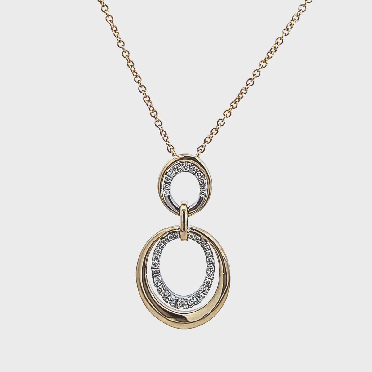 1/4ct. t.w. Diamond Oval Drop Pendant in 14K Yellow Gold and Platinum