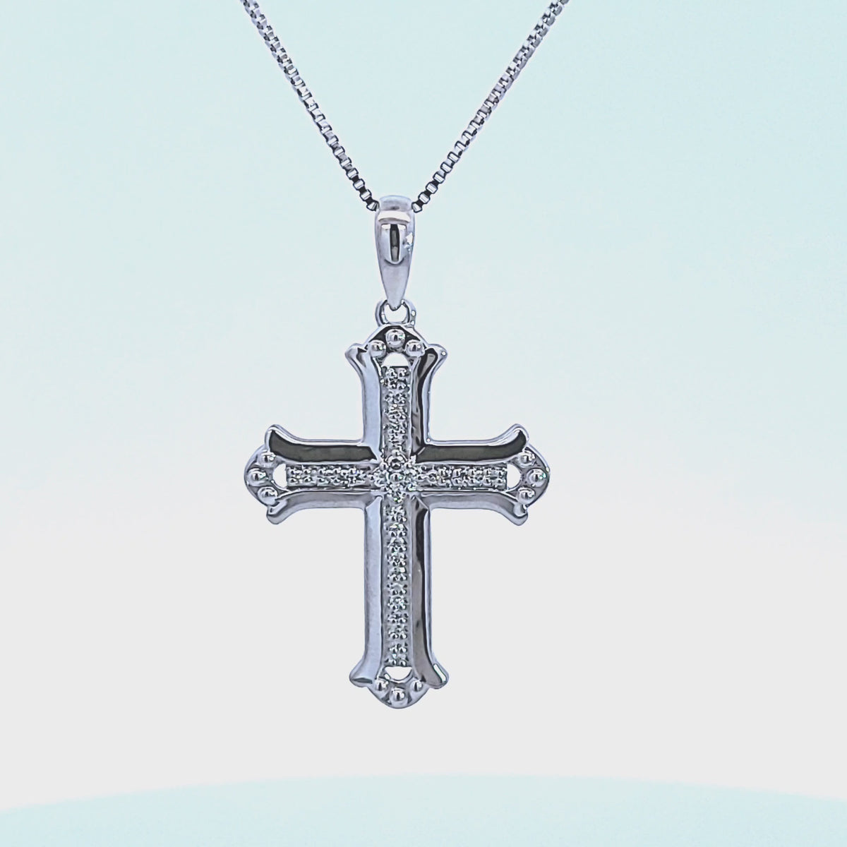 1/10ct. t.w. Diamond Cross Pendant in Sterling Silver