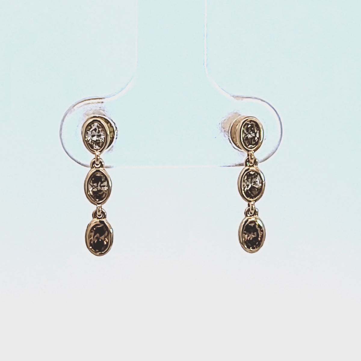 1/3ct. t.w. Brown Graduating Oval Cut Bezel Set Diamond Dangle Earrings in 14K Yellow Gold